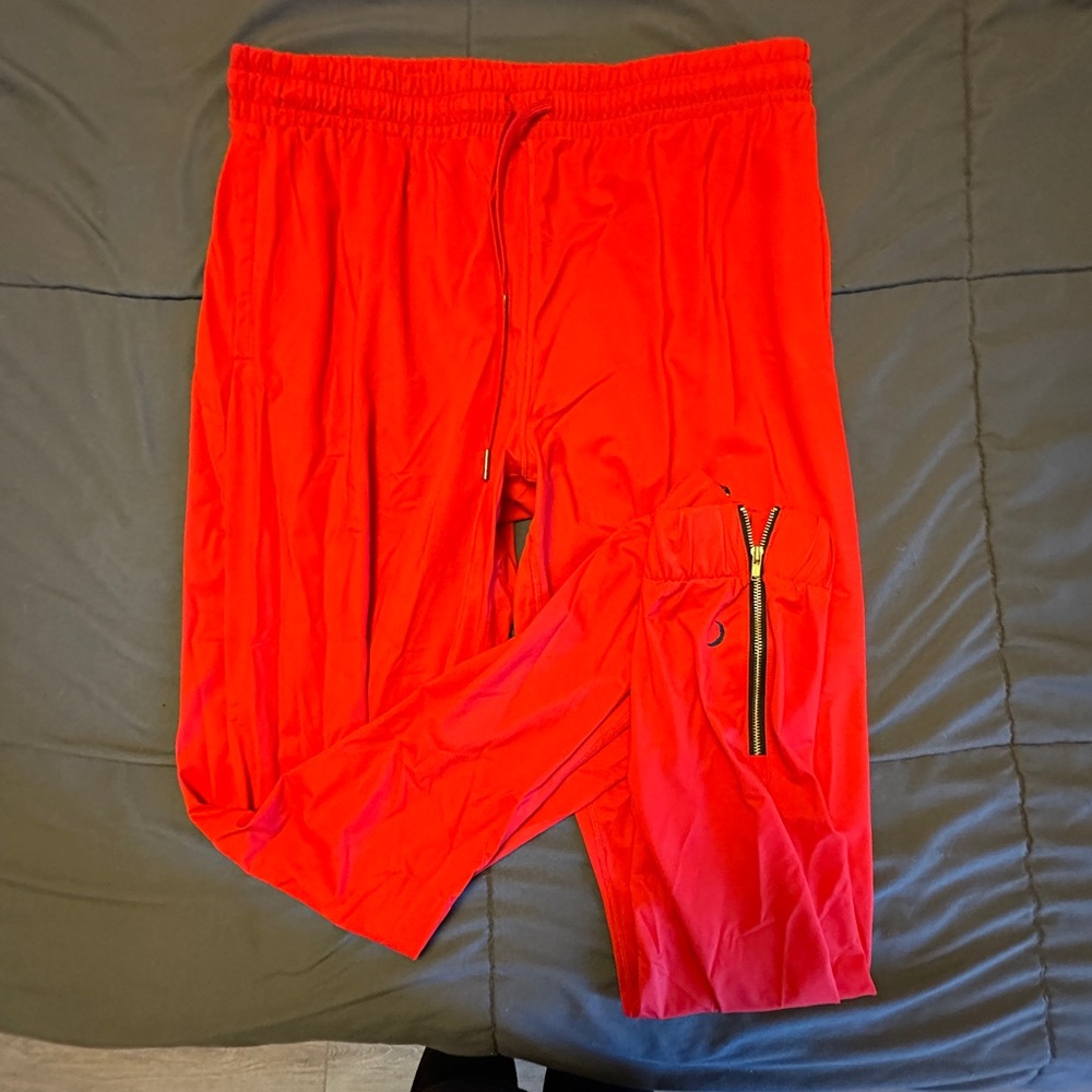 Red Zyia Activewear Joggers with cuffed ankles + zippers